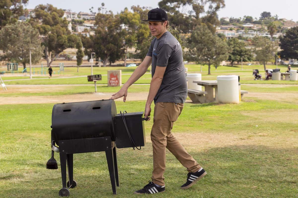 Man grilling in park